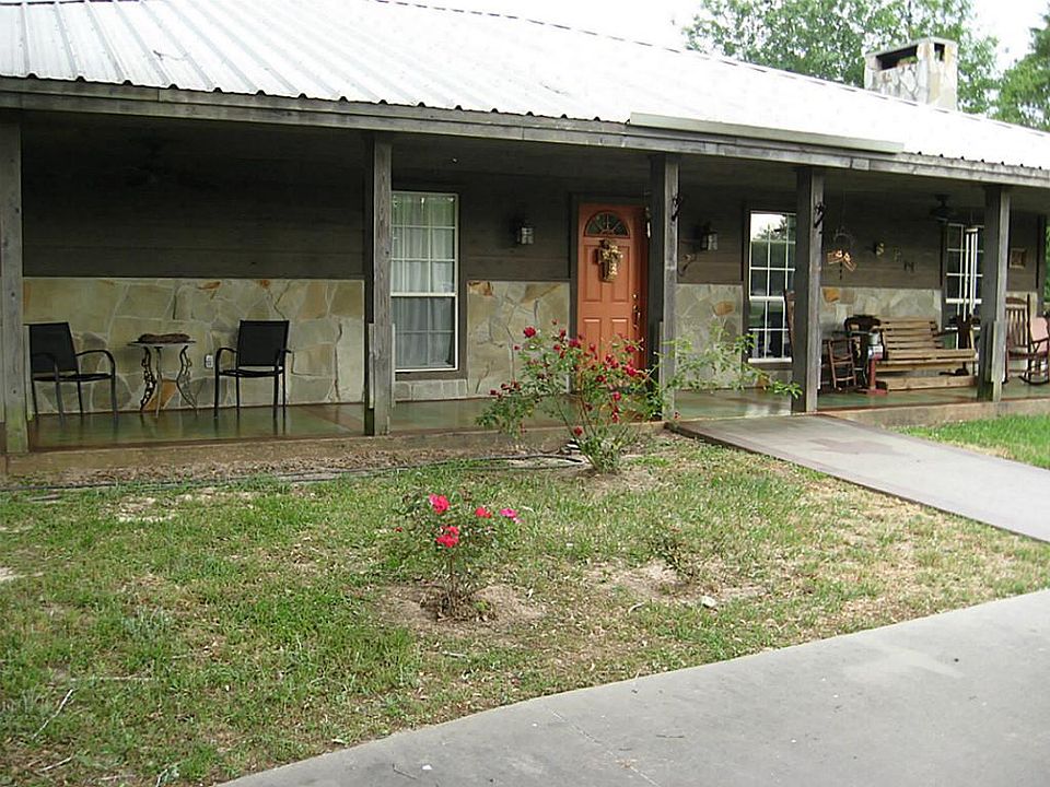 Welcome home to 11653 Warner Rd! This great home features a long front and side porch for relaxing a