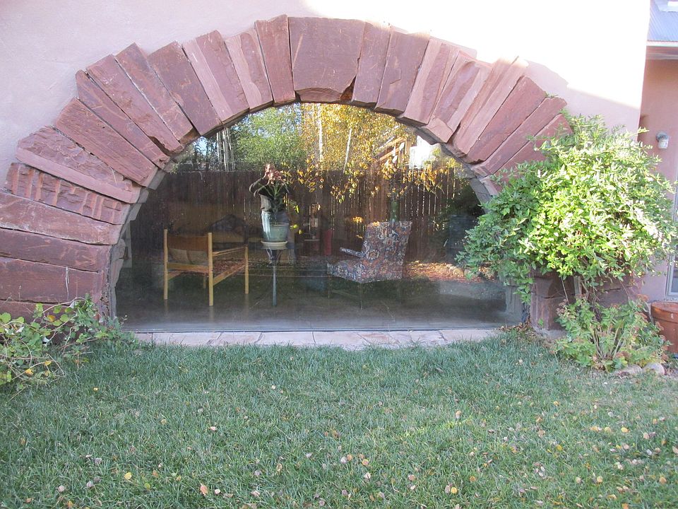 Stonework adds architectural accents and thermal mass.