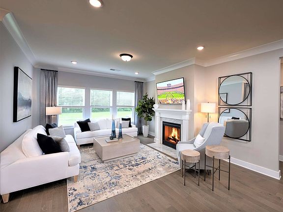Gather around the fireplace to watch movies with the family.