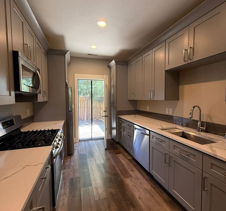 Kitchen with back door to fenced yard.