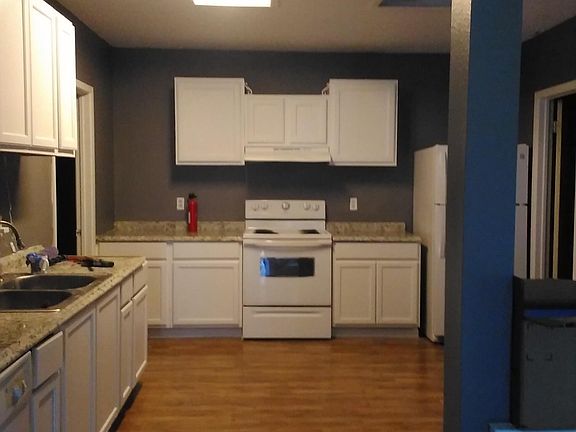Finishing touches forthcoming for move-in. Picture of kitchen.