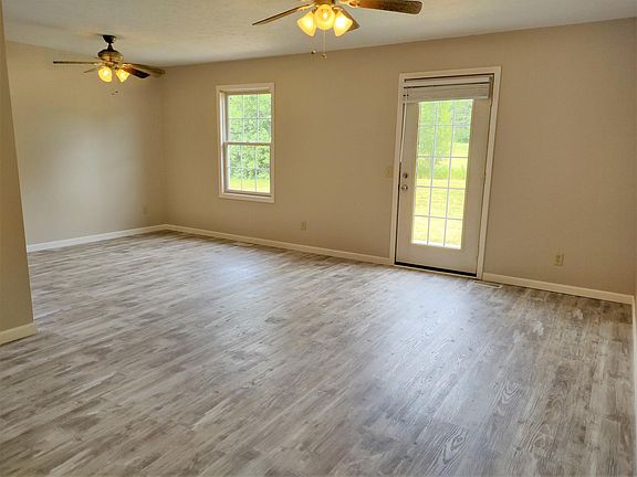 Living room with door to rear patio