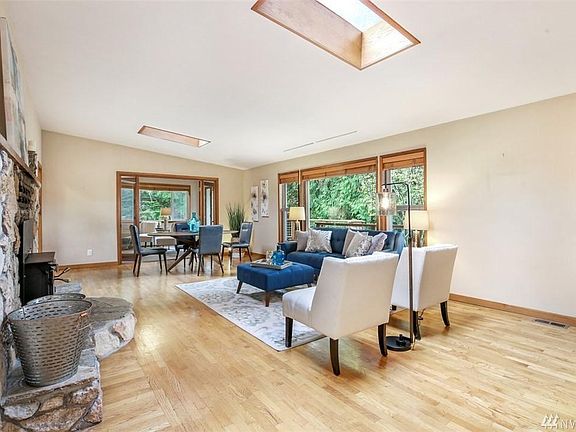 Living room to dining area from entry. Den/Office space is beyond the dining area (no photo).