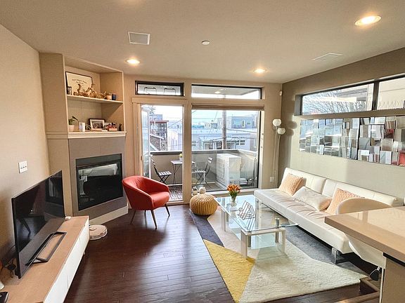 Living room. AC external unit on 2nd floor balcony. Mini splits in living room and master bedroom