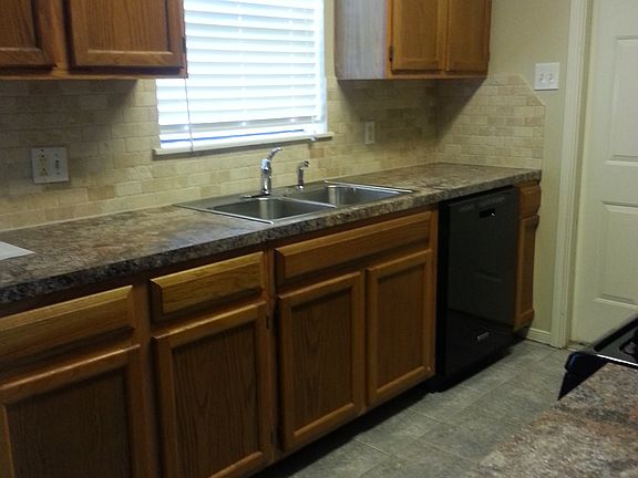 Kitchen w view of backyard