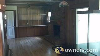 Den with fireplace and built ins