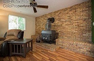 Family room with wood burning fireplace