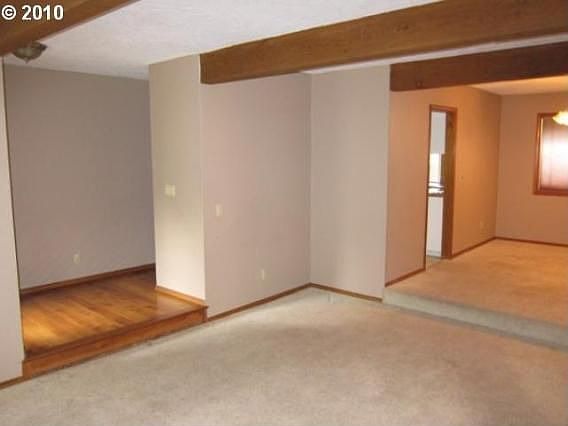 Sunken Living room leading to dining room (on right)