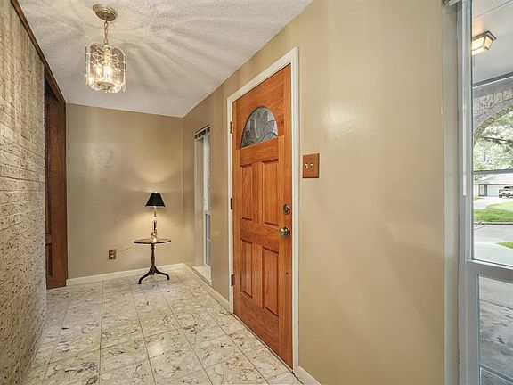 Enter through the solid front door into the tiled foyer with two windows on either side of the entrance door to bring in natural light.
