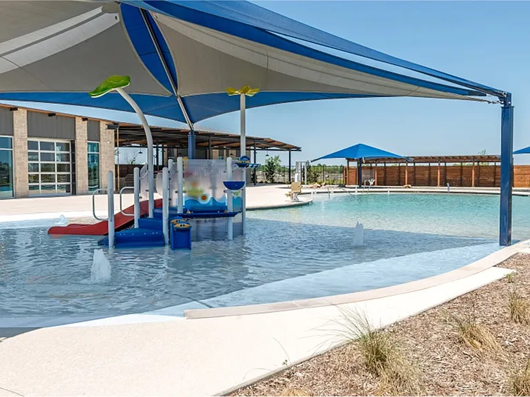 The splash-pad for little ones is connected to the community pool and is shaded perfectly to protect little ones from the strong Texas sun.
