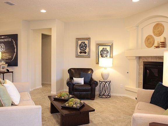 Large gathering room with indoor corner fireplace