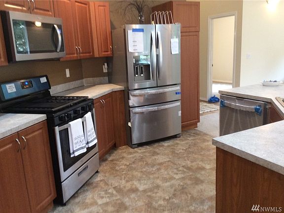 Your kitchen features new appliances along with sliding shelves in both the lower cabinets along side the range/ oven and sliding shelves in your pantry along wide the refirdgerator for ease of access to so many spices and kitchen storage. 