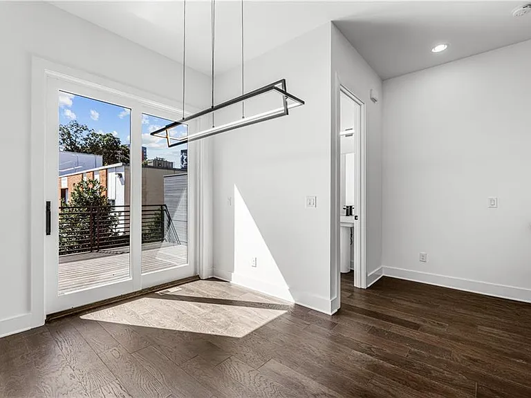 Dining Room (Note: Actual unit has light wooden floors and upgraded fixtures / appliances)
