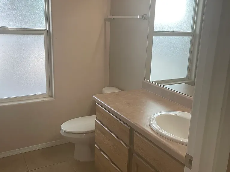 Master bedroom bathroom with vanity, toilet and tub/shower combo