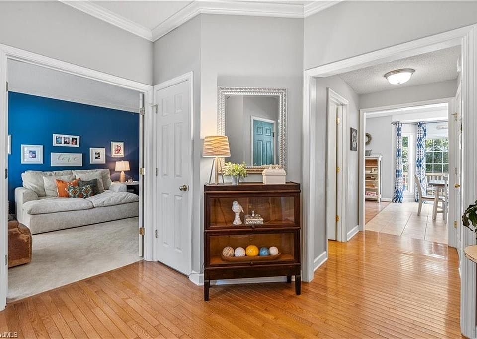 A Living Room With Furniture And Wooden Floor Greensboro: Stylish & Cozy Ideas