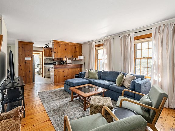 Living room is adjacent to the kitchen for a semi-open concept area