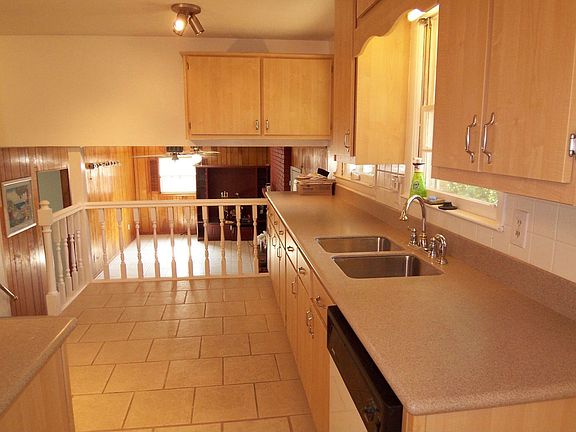 Kitchen with new corian countertops and refaced cabinets!