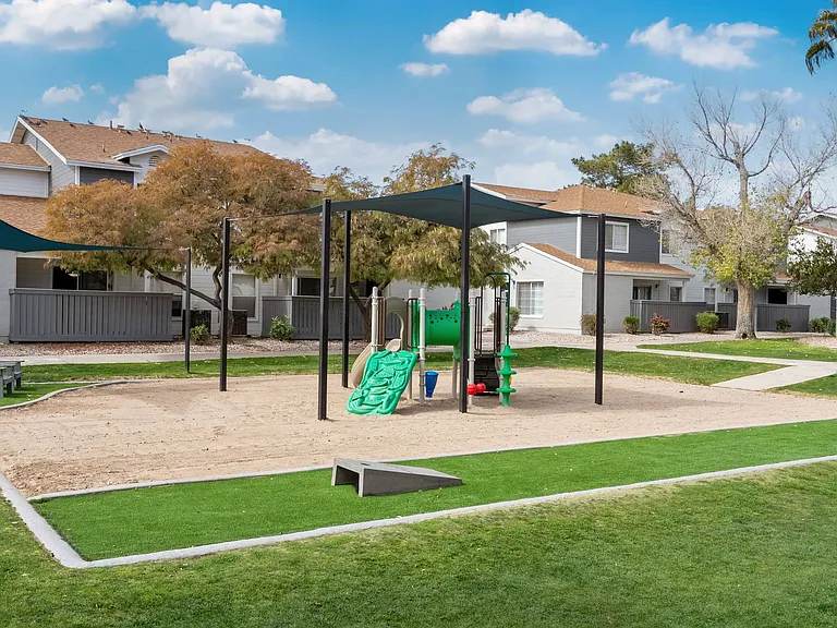 Watch with joy as children revel in our vibrant playground and sandy play area.