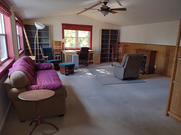 Large den/family room. Sofa has a removable cover on it.