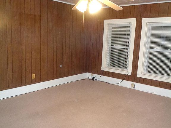 Living room with ceiling fan.