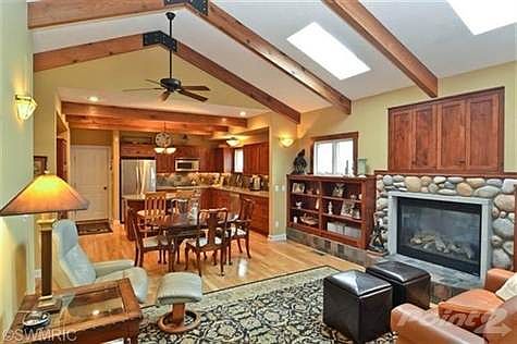 Open floor plan with vaulted ceilings, hardwood floors and great finish package.