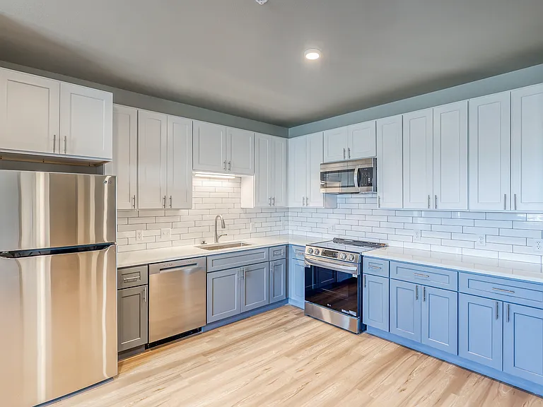 3BR kitchen - finishes and appliances are the same in all units, see Matterport tours on property website
