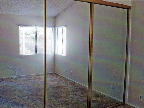 mirrored closet doors in master bedroom