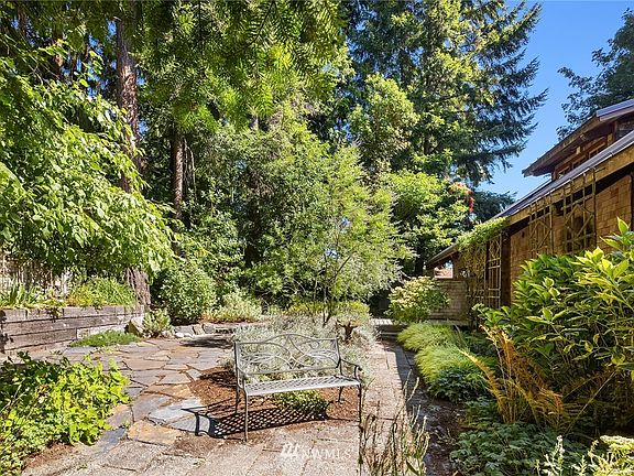Another view of the elegant entry courtyard. Two-car detached garage is just outside frame on the left. 