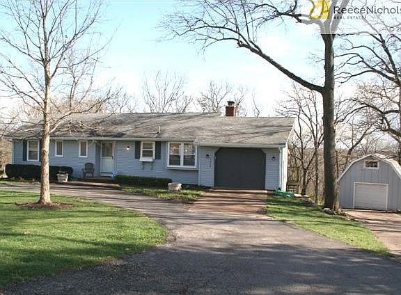 Large outbuilding with plenty of space for boy toys; motorcycles, boat, 4-wheelers, bikes, lawn mower, etc.