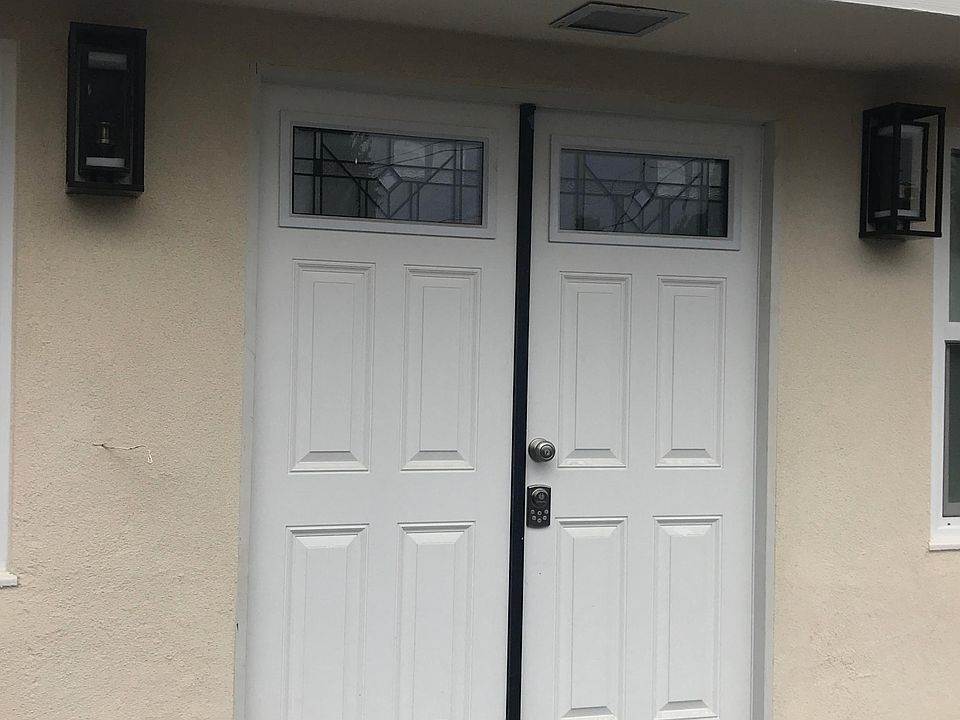 Double Door Front Entrance with upgraded sconces. Camera enabled with touch key entrance.