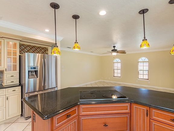 Kitchen overlooks family rm
