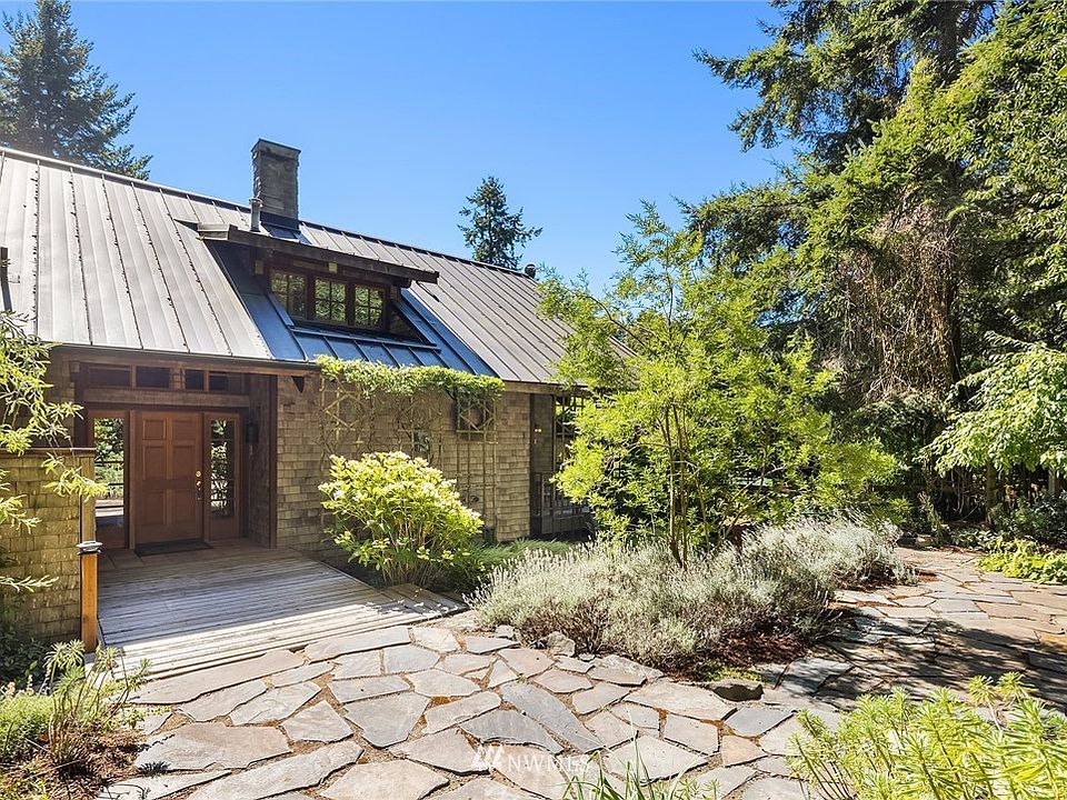 Beautiful entry courtyard is serene and quiet with easy-care, mature landscaping.