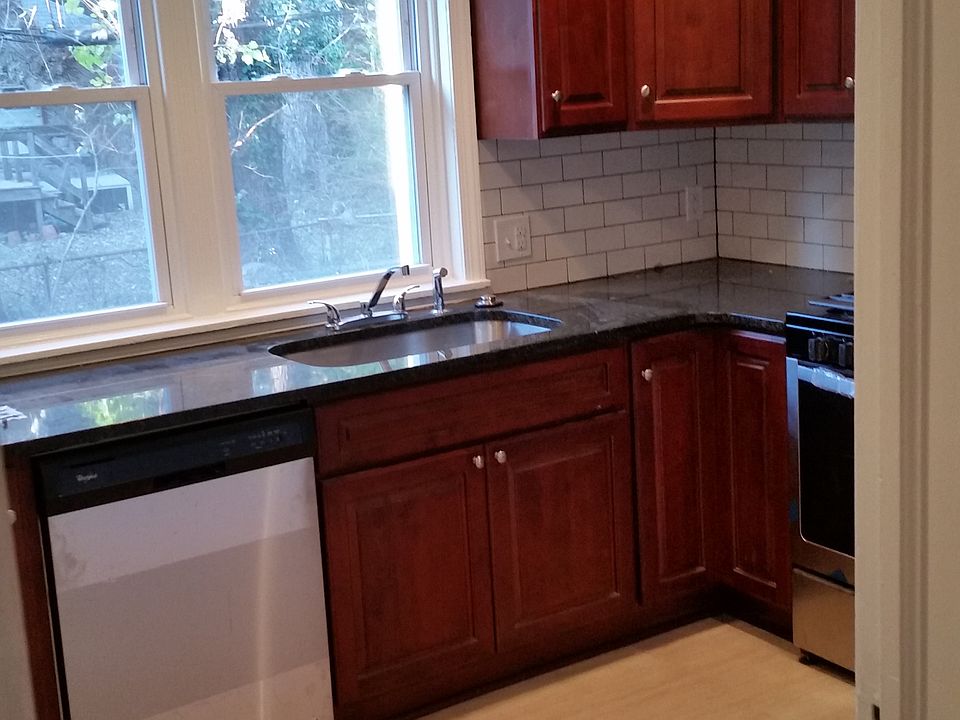 A bright kitchen with great views of landscaped yard.