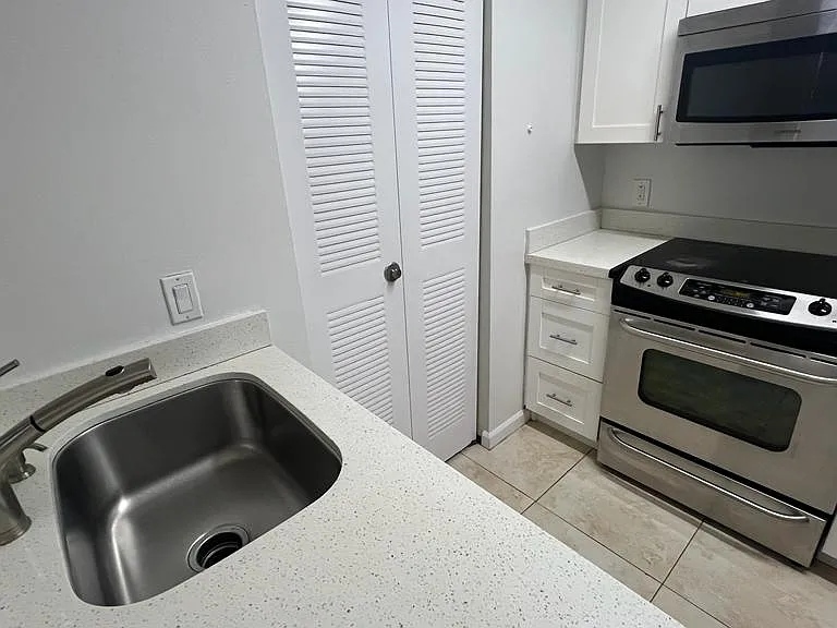 Extremely functional kitchen. Appliances: Refrigerator, stove, microwave, and dishwasher. Plus clothes washer/dryer.