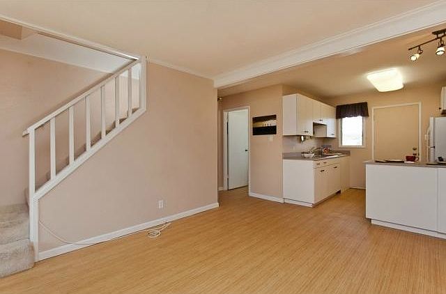 Living area opens to kitchen.