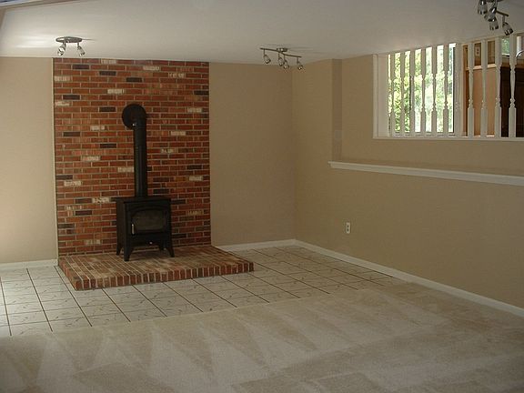 Family Room has Woodstove and New Carpet
