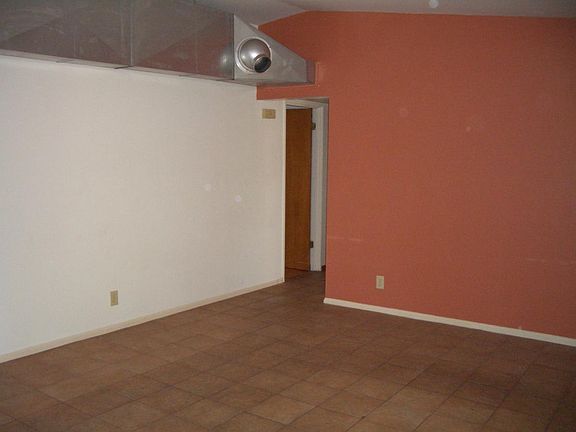 Living room with modern exposed ductwork