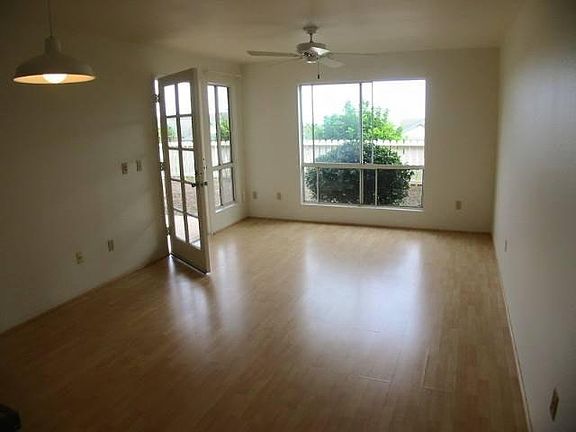 Large living room with lots of natural light