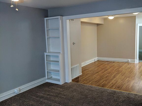 View of living room and dining room. 