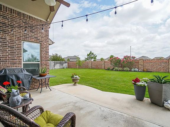 Enjoy the tranquil backyard under the large covered patio.
