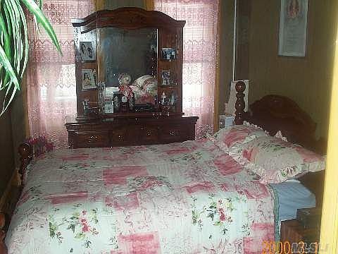 Master bedroom on 1st floor with extra exit/entrance to hallway.