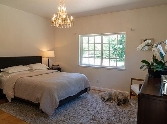 One of the three sunny bedrooms with en suite bathroom.
