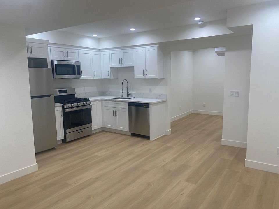 Spacious kitchen with separate living area and eating area.