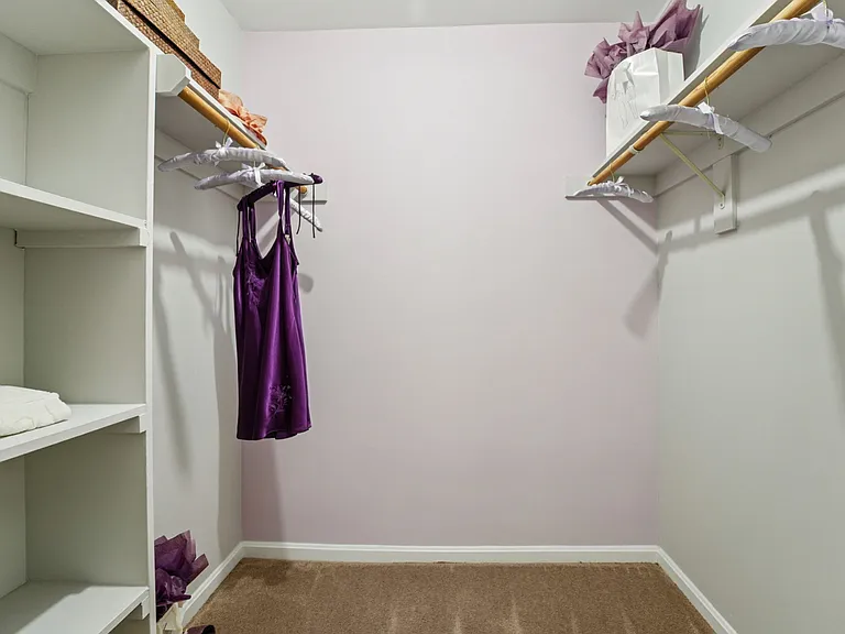 2 Bedrooms, 2 Full Bathrooms, 1147 Square Feet - Primary Bedroom's Walk-in Closet with Shelving