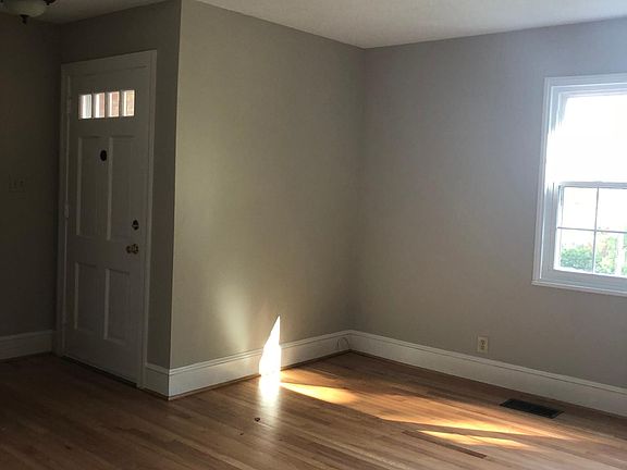 Living Room has fireplace and beautifully refinished hardwoo