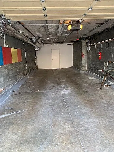 Attached enclosed 2 car tandem garage.