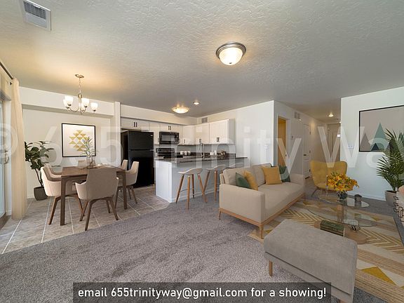 light-filled dining room / kitchen / living space with glass patio doors opening to your private backyard