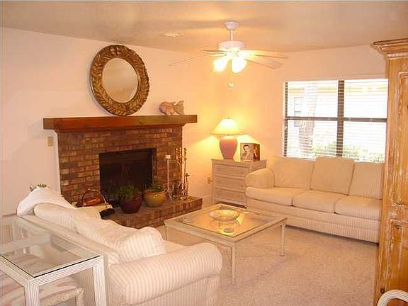 Living area is open and has a wonderful wood burning fireplace