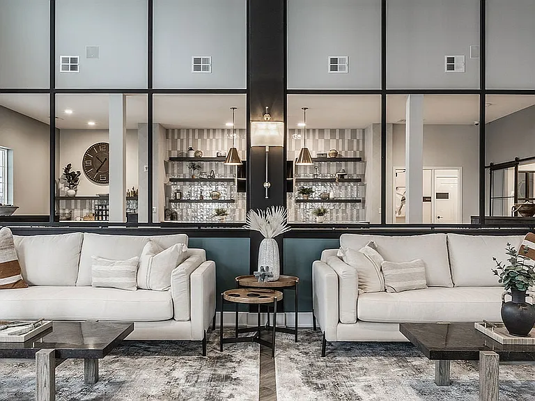 The Nese clubhouse includes a cozy lounge for residents to relax, read, play games, or gather with friends and neighbors.