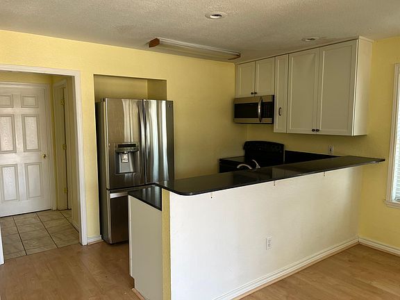 Kitchen with bar height countertop